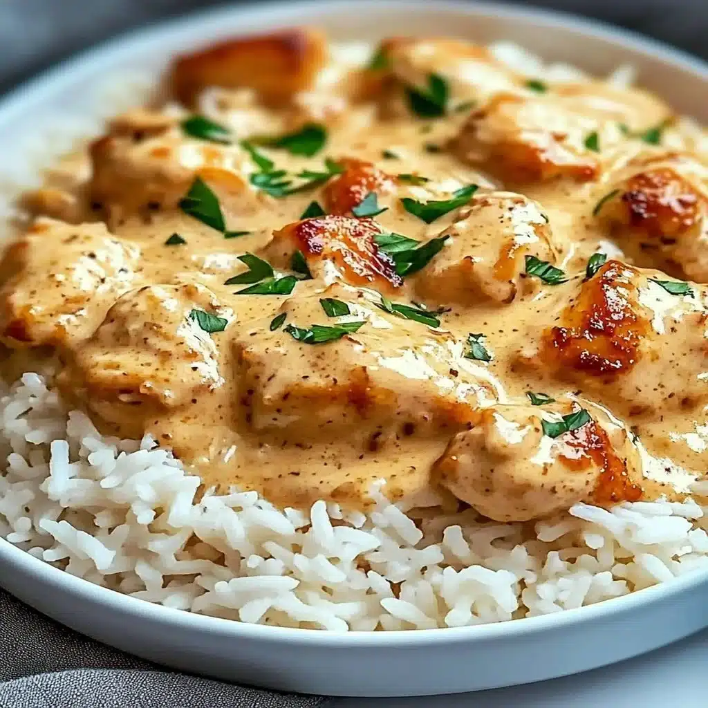 Delicious smothered chicken served with rice on a plate