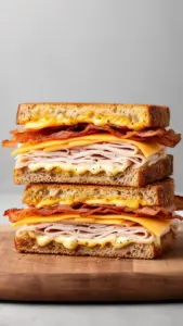Cheddar and bacon turkey melt sandwich on sourdough bread