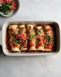 Delicious easy enchiladas recipe with cheese, chicken, and salsa