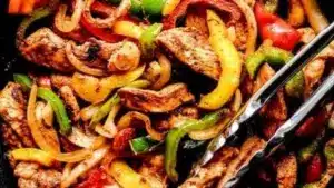 Delicious and colorful easy chicken fajitas served on a plate